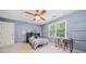 Bedroom with a window, desk, and ceiling fan at 1763 Benningfield Sw Dr, Marietta, GA 30064