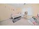 Well-lit bedroom with a bed, desk, and ample storage space at 1763 Benningfield Sw Dr, Marietta, GA 30064