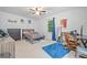 Bright bedroom with desk area, ceiling fan, and ample natural light at 1763 Benningfield Sw Dr, Marietta, GA 30064
