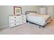 This bedroom has a bed and dresser and is painted a soothing green color at 1763 Benningfield Sw Dr, Marietta, GA 30064