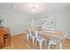 Dining room featuring wood floors, a wooden table, and white chairs at 1763 Benningfield Sw Dr, Marietta, GA 30064