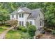 Rear exterior of the home featuring brick and siding with a screened in porch at 1763 Benningfield Sw Dr, Marietta, GA 30064