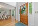 Entryway featuring wood floors, front door with sidelights, and a dining room view at 1763 Benningfield Sw Dr, Marietta, GA 30064