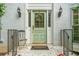 Close up of the front door with wreath and black sconces at 1763 Benningfield Sw Dr, Marietta, GA 30064