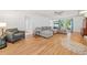 Spacious living room featuring hardwood floors, a gray sofa, and plenty of natural light at 1763 Benningfield Sw Dr, Marietta, GA 30064