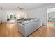 Inviting living room with hardwood floors, gray sofa, and easy access to other living spaces at 1763 Benningfield Sw Dr, Marietta, GA 30064