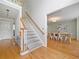 Foyer area with hardwood floors, stairs, and view to the dining room at 1763 Benningfield Sw Dr, Marietta, GA 30064