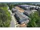 Aerial view of newly built townhomes with lush landscaping and ample parking at 1923 Deco Dr, Kennesaw, GA 30144