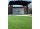 Outdoor venue with a spacious stage and manicured lawn for events and performances at 1923 Deco Dr, Kennesaw, GA 30144