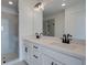 Modern bathroom featuring double sinks, stone countertops, sleek black fixtures, and a glass enclosed shower at 1923 Deco Dr, Kennesaw, GA 30144