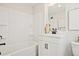 Clean white bathroom featuring tub, shower, vanity, and modern fixtures at 1923 Deco Dr, Kennesaw, GA 30144