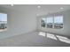 Spacious bedroom with multiple large windows offering plenty of natural light and neighborhood views at 1923 Deco Dr, Kennesaw, GA 30144