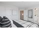 Bedroom featuring a neutral color palette, with a closet, bathroom access, and a bright window at 1923 Deco Dr, Kennesaw, GA 30144