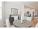 Eat-in kitchen nook with round table and decorative art at 1923 Deco Dr, Kennesaw, GA 30144