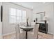 Eat-in kitchen nook featuring a round table, large windows, and decorative wall art at 1923 Deco Dr, Kennesaw, GA 30144