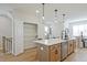Kitchen island with quartz countertops and pendant lighting at 1923 Deco Dr, Kennesaw, GA 30144