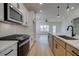 Kitchen featuring stainless appliances, kitchen island, hardwood floors, and sink at 1923 Deco Dr, Kennesaw, GA 30144