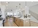 Modern kitchen featuring a kitchen island with pendant lighting, stainless steel appliances and hardwood floors at 1923 Deco Dr, Kennesaw, GA 30144