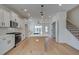 Kitchen featuring stainless appliances, kitchen island, and hardwood floors at 1923 Deco Dr, Kennesaw, GA 30144