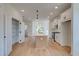 Modern kitchen with white cabinets, a central island, stainless steel appliances, and hardwood floors at 1923 Deco Dr, Kennesaw, GA 30144