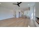 Open-concept living room with hardwood floors, seamlessly flowing into the kitchen and dining area at 1923 Deco Dr, Kennesaw, GA 30144