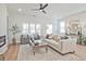 Bright living room featuring neutral tones, stylish furniture, fireplace and natural light from large windows at 1923 Deco Dr, Kennesaw, GA 30144