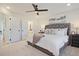 Relaxing main bedroom with plush carpet, en-suite bathroom access, a ceiling fan, and natural light at 1923 Deco Dr, Kennesaw, GA 30144