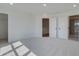 Open main bedroom layout featuring neutral carpeting with easy access to the walk-in closet and bathroom at 1923 Deco Dr, Kennesaw, GA 30144