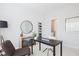 Well-lit home office space featuring desk, chair, and minimalist decor elements at 1923 Deco Dr, Kennesaw, GA 30144