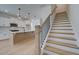 Open-concept home showcases a staircase with wood treads, white risers, and a black iron railing at 1923 Deco Dr, Kennesaw, GA 30144