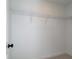 An all-white walk-in closet with wire shelving for organized storage in a modern home at 1923 Deco Dr, Kennesaw, GA 30144