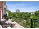 Relaxing balcony seating area with treetop views of the city at 3280 Stillhouse Se Ln # 401, Atlanta, GA 30339
