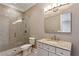 Modern bathroom featuring a glass-enclosed shower and vanity with a granite countertop at 3280 Stillhouse Se Ln # 401, Atlanta, GA 30339