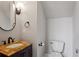 Powder room includes granite counter top and fixtures at 3280 Stillhouse Se Ln # 401, Atlanta, GA 30339
