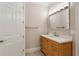 Bathroom featuring a wooden vanity with quartz countertop at 3280 Stillhouse Se Ln # 401, Atlanta, GA 30339