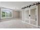 Spacious bedroom features sliding closet doors and a large window with natural light at 3280 Stillhouse Se Ln # 401, Atlanta, GA 30339