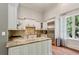 Well-appointed kitchen with custom cabinets, granite countertops, and stainless steel appliances at 3280 Stillhouse Se Ln # 401, Atlanta, GA 30339