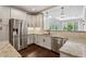 Bright kitchen featuring stainless steel appliances, granite countertops, and plenty of cabinets at 3280 Stillhouse Se Ln # 401, Atlanta, GA 30339