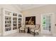 Cozy library with built-in bookshelves, elegant seating, and a charming French door at 3280 Stillhouse Se Ln # 401, Atlanta, GA 30339