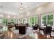 Spacious lounge with hardwood floors, comfortable seating, and lots of natural light at 3280 Stillhouse Se Ln # 401, Atlanta, GA 30339
