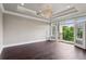 Bright bedroom with hardwood floors and balcony access at 3280 Stillhouse Se Ln # 401, Atlanta, GA 30339