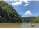 People paddling kayaks and rafts on the Chattahoochee River near the Paces Mill access point at 3280 Stillhouse Se Ln # 401, Atlanta, GA 30339