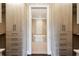 Spacious walk-in closet with built-in shelving and drawers, leading to the Primary bath at 3280 Stillhouse Se Ln # 401, Atlanta, GA 30339