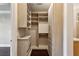 Spacious walk-in closet with built-in shelving and drawers at 3280 Stillhouse Se Ln # 401, Atlanta, GA 30339