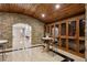 Cozy wine cellar featuring stone accents, wooden cabinets, and seating at 3280 Stillhouse Se Ln # 401, Atlanta, GA 30339