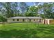 View of a home's backyard with a playground and shed at 3425 Poplar Dr, Lawrenceville, GA 30044