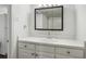 Well-lit bathroom featuring vanity with sink and storage space at 3425 Poplar Dr, Lawrenceville, GA 30044