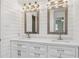 Bathroom boasts double vanity, shiplap accent wall, and decorative mirrors at 3425 Poplar Dr, Lawrenceville, GA 30044