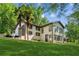 Charming two-story home with a spacious yard, showcasing a blend of classic and modern architectural elements at 3425 Poplar Dr, Lawrenceville, GA 30044