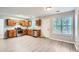 Kitchen showcasing wood cabinets, light countertops, stainless steel appliances, and an exterior door at 7078 Ravenwood Ln, Lithonia, GA 30038